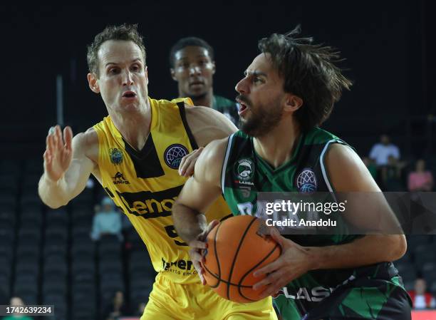 Can Korkmaz of Darussafaka Lassa in action against Marcelinho Huertas of Lenovo Tenerife during the Basketball Champions League Group C week 2 match...