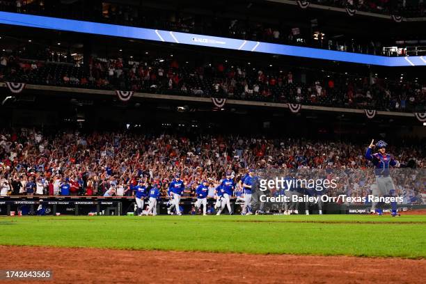 The Texas Rangers celebrate on field after defeating the Houston Astros in Game Seven of the American League Championship Series at Minute Maid Park...