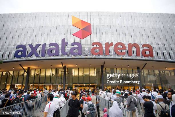 Attendees outside Axiata Arena during a pro-Palestinian rally in Kuala Lumpur, Malaysia, on Tuesday, Oct. 24, 2023. US President Joe Biden said...