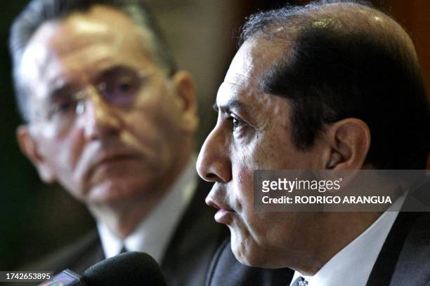 Parmenio Cuellar , governor of the Navy Department, talks during a press conference next to governor of Tolima Guillermo Jaramillo 30 March 2001 in...