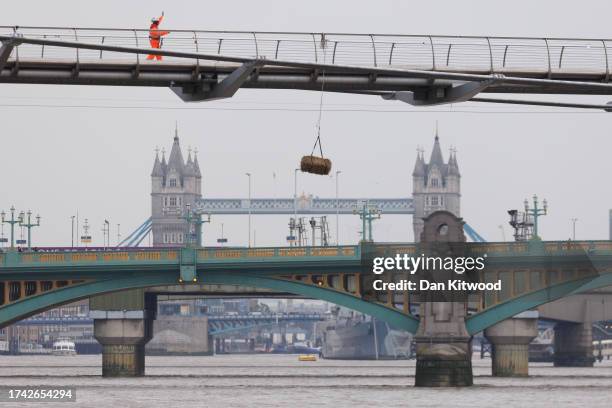 Owing to a by-law, a hay bail hangs under Millennium Bridge as work continues on October 18, 2023 in London, England. The by-law in question is 36.2...