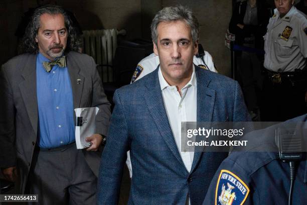 Michael Cohen returns to the courtroom following a break in his testimony against his former employer and US President, Donald Trump, in New York...