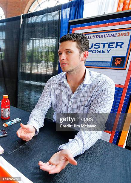 Buster Posey of the San Francisco Giants answers questions during media availability prior to All-Star Workout Day on July 15, 2013 at Citi Field in...