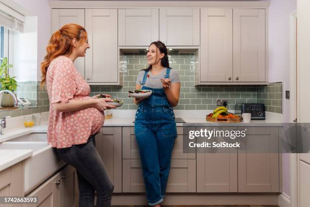healthy pregnant friends - girlie room stock pictures, royalty-free photos & images