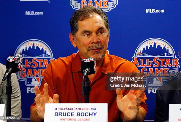Manager Bruce Bochy of the San Francisco Giants answers questions during media availability prior to All-Star Workout Day on July 15, 2013 at Citi...