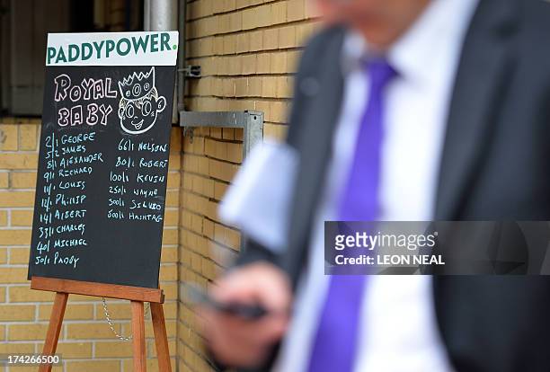 Chalkboard displays the latest odds for the name of the royal baby from a leading bookmaker is positioned outside The Lindo Wing of Saint Mary's...