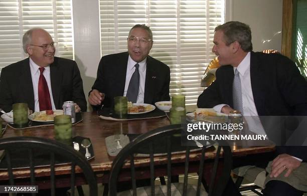 President-elect George W. Bush shares a working lunch at his ranch with former chairman of the Joint Chiefs of Staff, General Colin Powell and US...