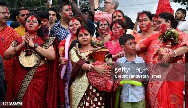 Devotees during immersion of idol of Goddess Durga in the river Hooghly on the tenth day of Durga Puja Festival at Baje Kadamtala Ghat on October 24,...