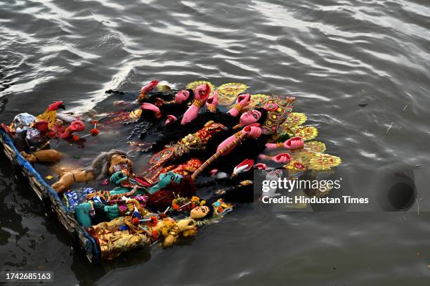 Durga idol being immersed into the Hooghly River on the tenth day of Durga Puja Festival at Jadges Ghat on the banks of river Hooghly on October 24,...