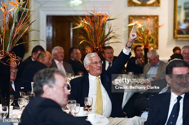 Guests bid in the charity auction during the Gary Player Invitational Europe 2013 Gala Dinner at Wentworth on July 22, 2013 in Virginia Water,...