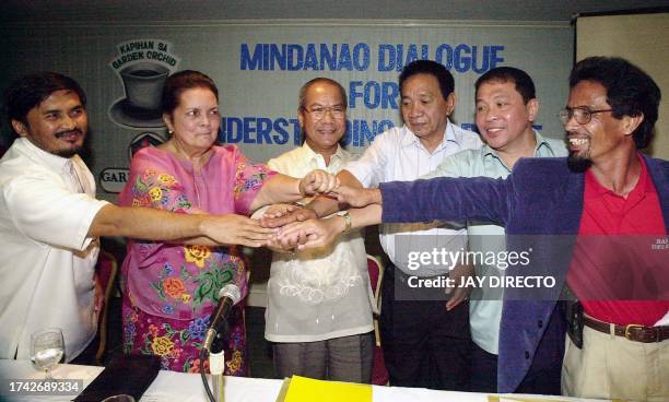 Philippines National Security Adviser Secretary Alexander Aguirre meets with the local leaders, from L to R: Taha Basman, Secretary General of the...