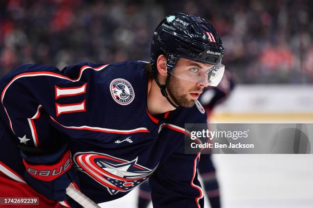 Adam Fantilli of the Columbus Blue Jackets lines up prior to a face-off during the third period of a game against the Detroit Red Wings at Nationwide...