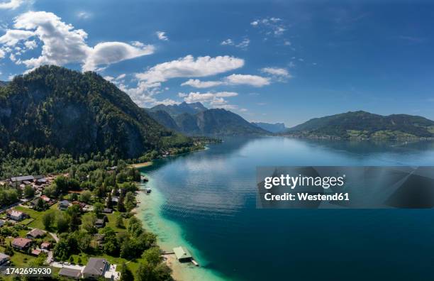 austria, upper austria, weissenbach am attersee, drone view of lake atter and surrounding village in summer - attersee stock-fotos und bilder