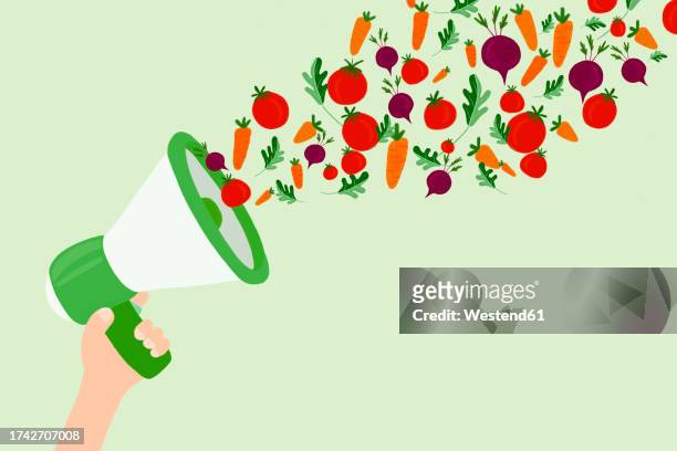 stockillustraties, clipart, cartoons en iconen met illustration of hand holding megaphonespewing raw vegetables - tomato stock illustrations