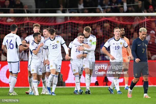 Billy Gilmour of Scotland celebrates with team mates after scoring his first international goal during the International Friendly match between...