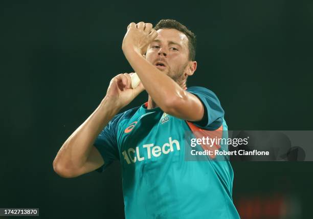 Josh Hazlewood of Australia bowls during an Australian training session at the ICC Men's Cricket World Cup India 2023 at M. Chinnaswamy Stadium on...