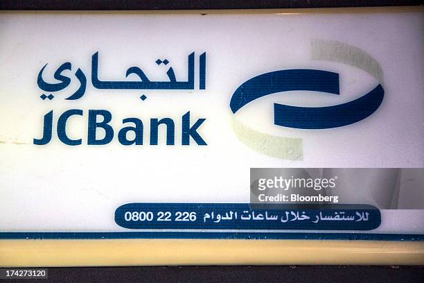Logo sits on display outside a branch of Jordan Commercial Bank in the financial district in Amman, Jordan, on Sunday, July 21, 2013. Jordanian...