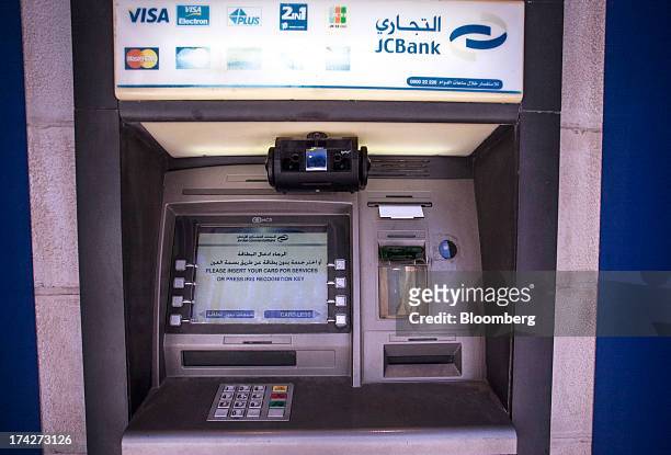 An iris scanner sits on automated teller machine outside a branch of Jordan Commercial Bank in the financial district in Amman, Jordan, on Sunday,...