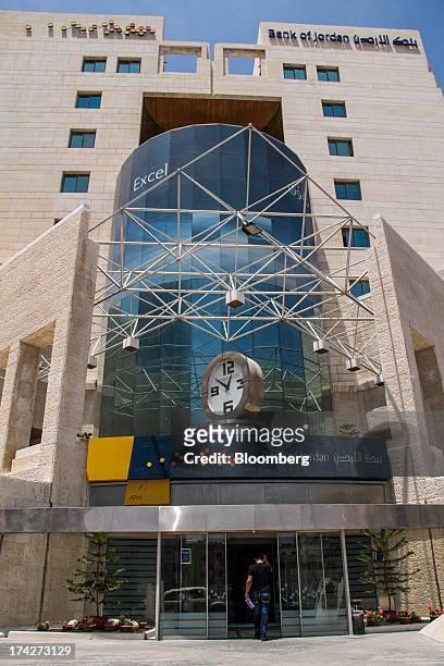 Customer enters the headquarters of the Bank of Jordan in the financial district in Amman, Jordan, on Sunday, July 21, 2013. Jordanian internal debt...
