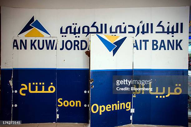 Boards cover a branch of Jordan Kuwait Bank under construction inside the Taj shopping mall in Amman, Jordan, on Sunday, July 21, 2013. Jordanian...