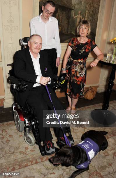 Melvin O'Dowd with dog Alice, and Jenny Moir attend the Dogs Trust Honours held at Home House on July 23, 2013 in London, England.