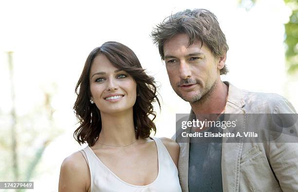 Actress Anna Safroncik and actor Roberto Farnesi attend 'La Tre Rose Di Eva 2' photocall at Mediaset Studios on July 23, 2013 in Rome, Italy.