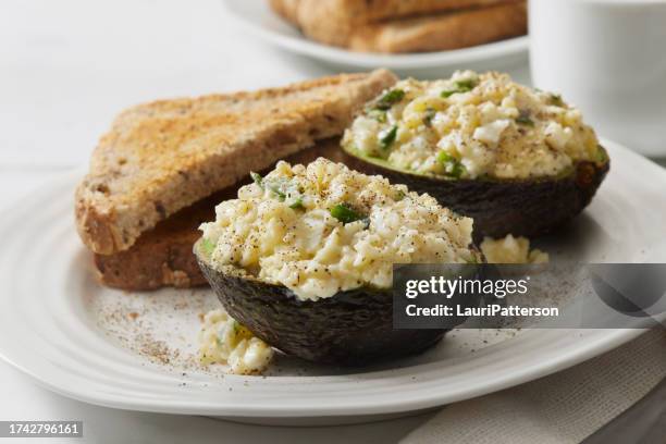 avocado egg salad boats - stuffed avocado stock pictures, royalty-free photos & images