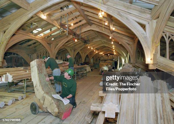 Craftsmen engaged in restoration work on Windsor Castle following its devastating fire, on 23rd May 1996.