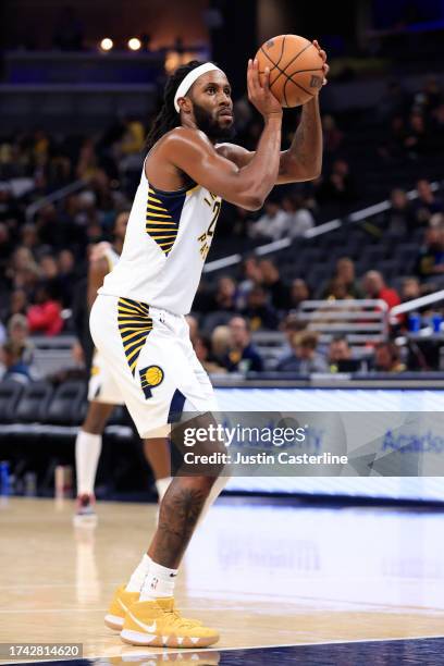 Isaiah Jackson of the Indiana Pacers shoots a free throw in the game against the Atlanta Hawks at Gainbridge Fieldhouse on October 16, 2023 in...