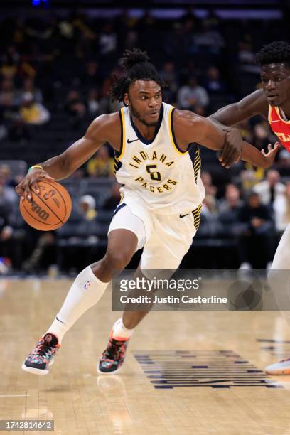 Jarace Walker of the Indiana Pacers drives to the basket in the game against the Atlanta Hawks at Gainbridge Fieldhouse on October 16, 2023 in...