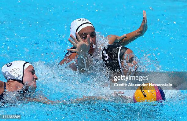 Katrina Monton of Canada is closed down by the USA defence during the Women's Water Polo first preliminary round match between USA and Canada during...