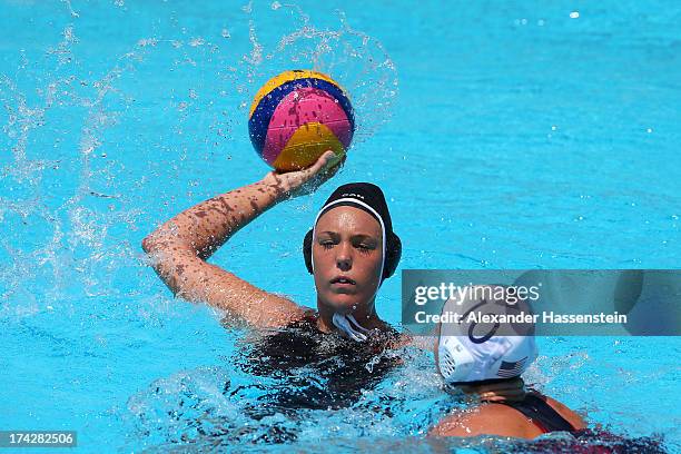 Sophie Baron la Salle of Canada passes as Kelly Rulon of USA closes in during the Women's Water Polo first preliminary round match between xx and xx...