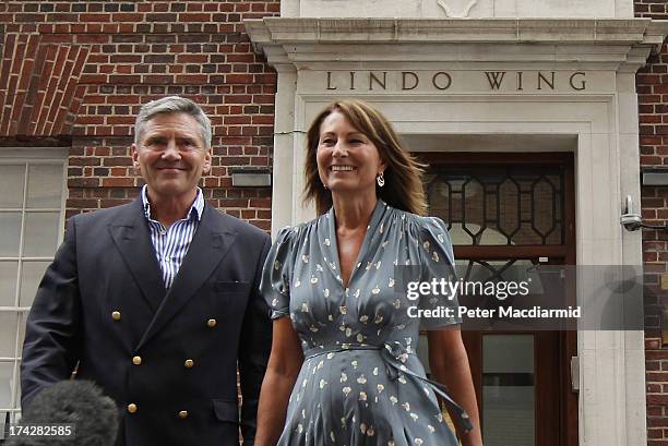 Carole Middleton and Michael Middleton leave The Lindo Wing after visiting The Duchess Of Cambridge and her newborn son at St Mary's Hospital on July...