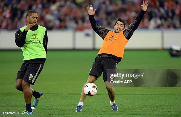 Liverpool's Pepe Reina and forward Luis Suarez in action during training in Melbourne on July 23, 2013. Liverpool play Melbourne Victory in a...