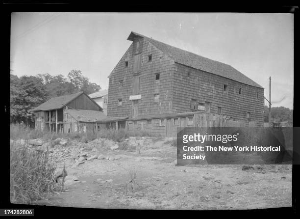 Huntington, Long Island: unidentified old wood-shake barn or water mill, possibly used as a clam shack, New York, New York, late 19th or early 20th...