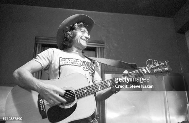 American Folk musician Ramblin' Jack Elliott plays an acoustic guitar as he performs on stage at the Ark, Ann Arbor, Michigan, September 25, 1975.