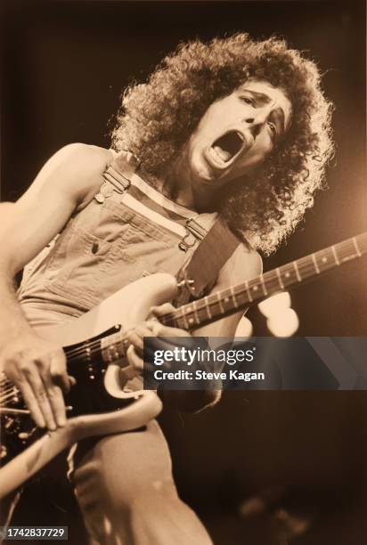 American Rock musician Neal Schon plays electric guitar as he performs on stage at the Rosemont Horizon theater, Rosemont, Illinois, May 1980.