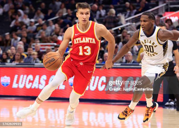 Bogdan Bogdanovic of the Atlanta Hawks drives to the basket in the game against the Indiana Pacers at Gainbridge Fieldhouse on October 16, 2023 in...