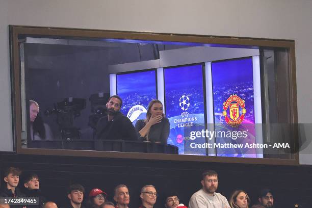 Paul Scholes, Rio Ferdinand and Laura Woods watch the match from the TNT Sports TV studio during the UEFA Champions League match between Manchester...