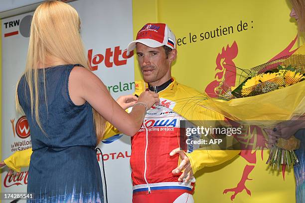 Russian Alexander Kolobnev wears the overall leader yellow jersay, on the podium of the fourth stage of the Tour De Wallonie cycling race between...