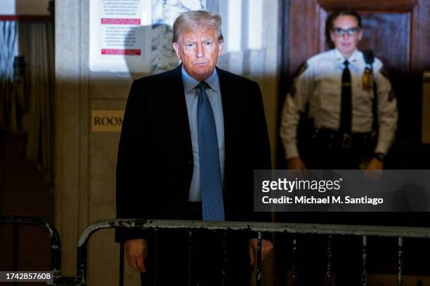 Former President Donald Trump speaks during a break at his civil fraud trial at New York State Supreme Court on October 18, 2023 in New York City....