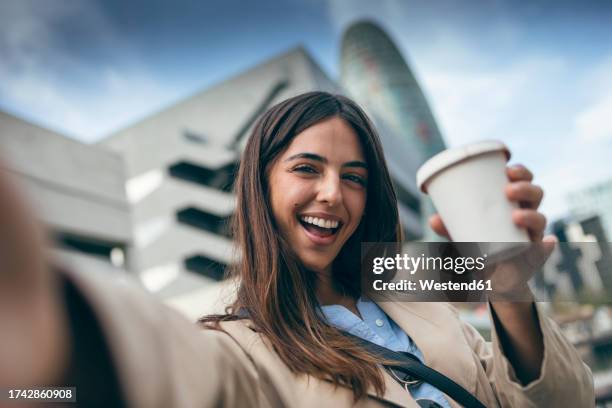 happy young woman taking selfie with coffee cup - disposable cup stock pictures, royalty-free photos & images