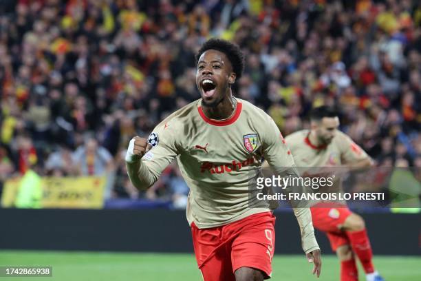 Lens' French forward Elye Wahi celebrates after scoring his team's first goal during the UEFA Champions League Group B first leg football match...