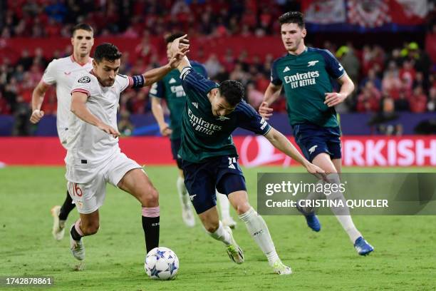 Sevilla's Spanish midfielder Jesus Navas vies with Arsenal's Brazilian midfielder Gabriel Martinelli during the UEFA Champions League 1st round day 3...