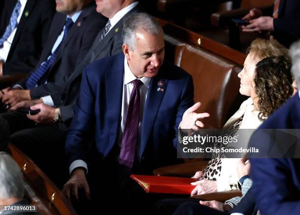 Rep. Mario Díaz-Balart talks to fellow lawmakers as the House of Representatives holds its second round of voting for a new Speaker of the House at...