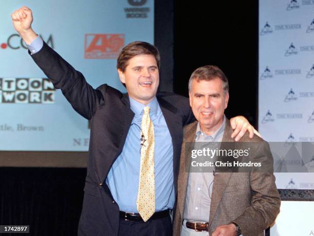 Steve Case, Chairman and CEO of America Online, left, and Gerald Levin, Chairman and CEO of Time Warner, right, hug on Monday, January 10, 2000 in...