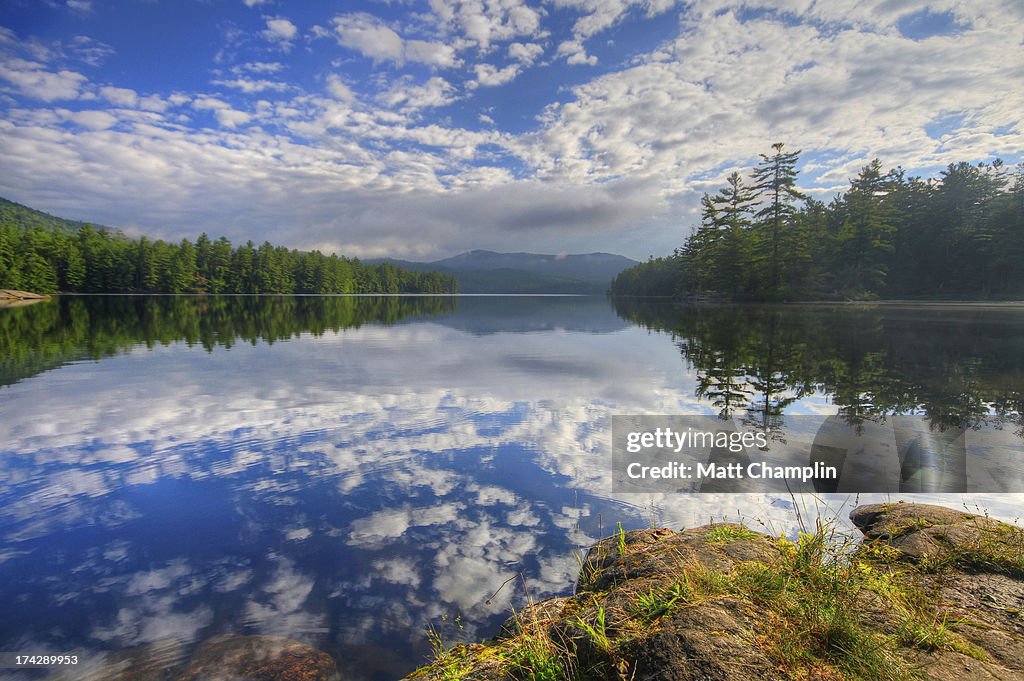 Morning Reflections and Clouds in Mountain Lake