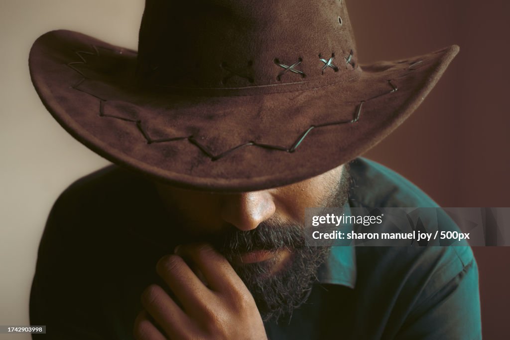 Close-up of man wearing hat