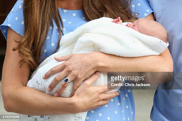 Prince William, Duke of Cambridge and Catherine, Duchess of Cambridge depart The Lindo Wing with their newborn son at St Mary's Hospital on July 23,...