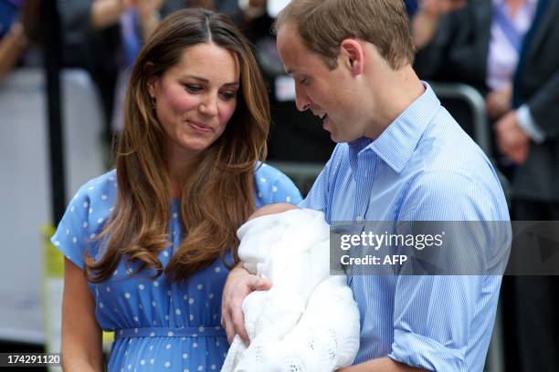 Prince William and Catherine, Duchess of Cambridge show their new-born baby boy to the world's media, standing on the steps outside the Lindo Wing of...
